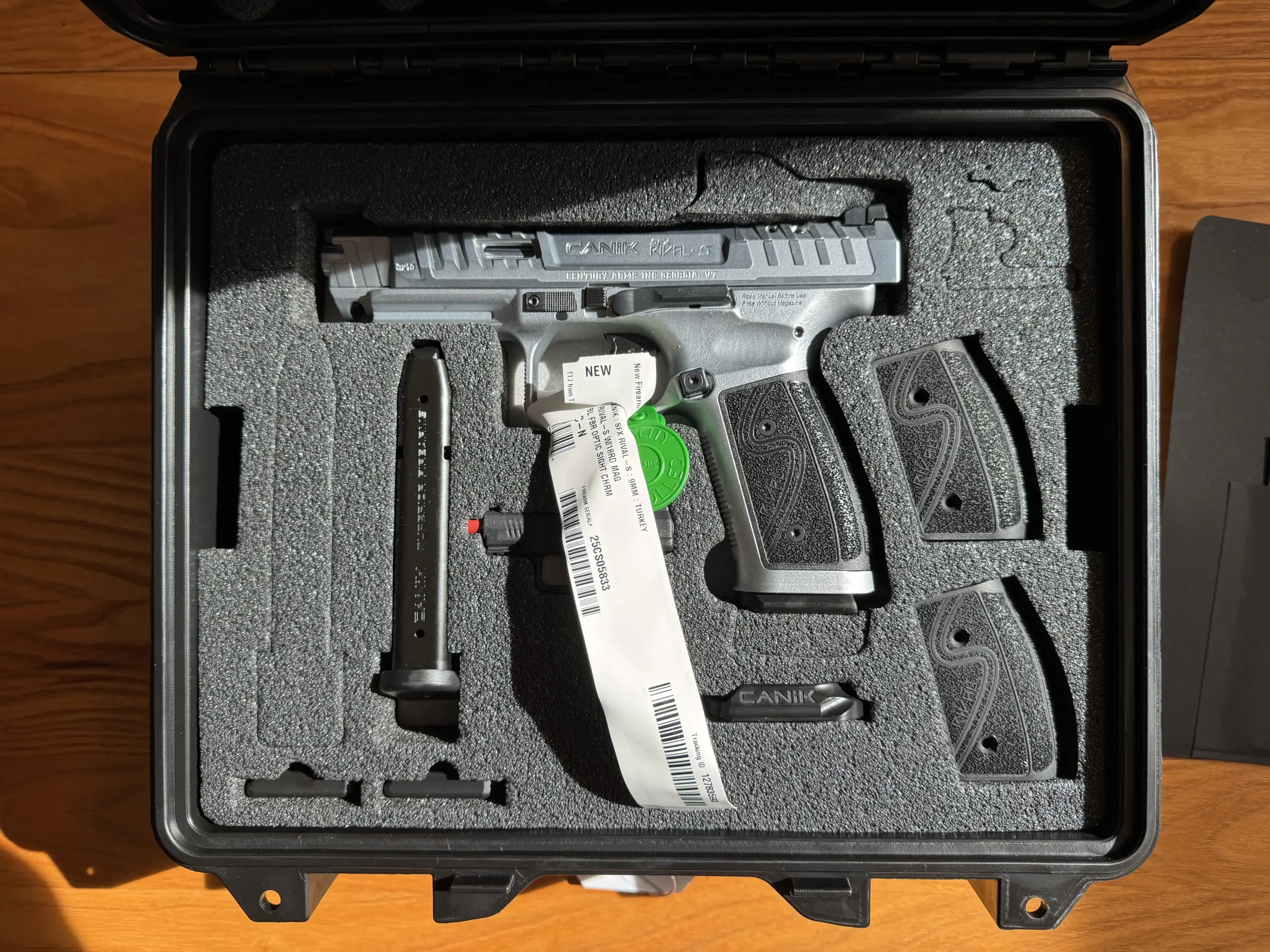 Canik SFx Rival-S 9mm competition pistol with silver steel frame, in its case.