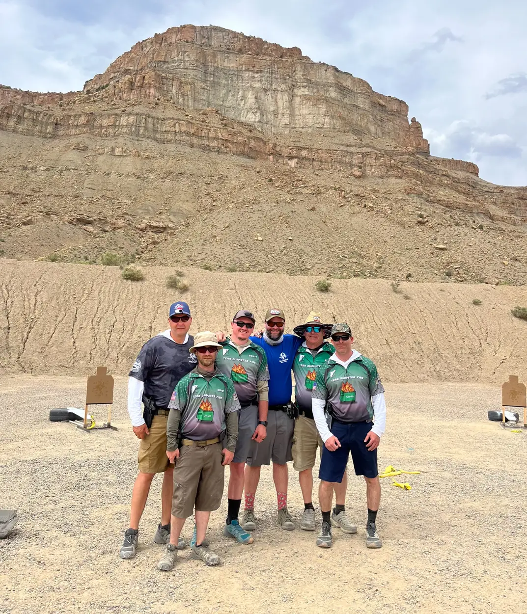 a group of people posing for a photo in front of a mountain - CFC Tactical
